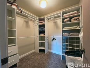 Mount Shasta apartment for rent - A bedroom with a large bed, a desk with a chair, and a ceiling fan.