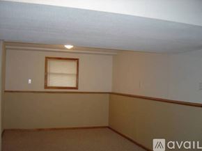 Olathe house for rent - A room with a window and a light on the ceiling.