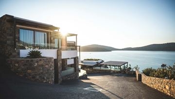 Los Angeles apartment for rent - A house with a patio overlooking a body of water.