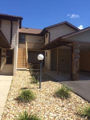 Hernando house for rent - A house with a brown roof and a gravel driveway.