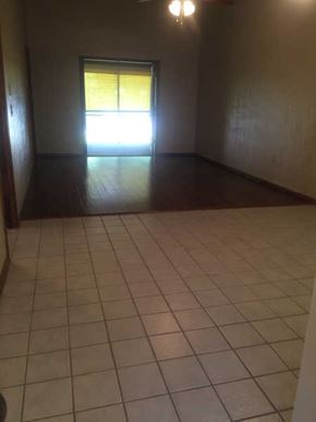 Hernando house for rent - A room with a tiled floor and a door leading to a balcony.