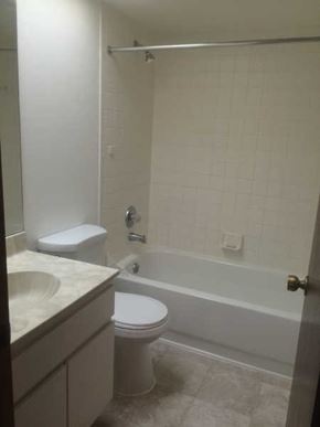 Hernando house for rent - A white toilet and sink in a small bathroom.
