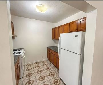 Monterey Park apartment for rent - A kitchen with a white refrigerator and brown cabinets.