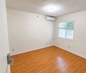 Monterey Park apartment for rent - A room with a window and a wooden floor.