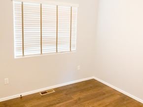 Show Low house for rent - A room with a window covered by white blinds.