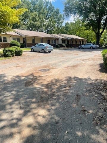 Reidsville apartment for rent - A car is parked in front of a house.
