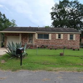 Hattiesburg house for rent - A brick building with a mailbox in front of it.