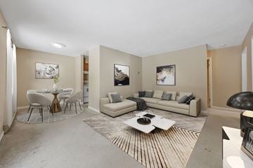 Kawartha Lakes apartment for rent - A living room with a white couch and a coffee table.