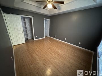 Athens house for rent - A kitchen with a white refrigerator and a checkered floor.
