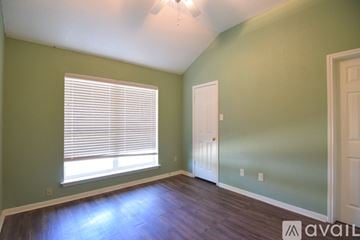 Copperas Cove house for rent - A kitchen with a refrigerator, microwave, and oven.