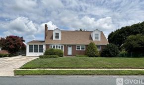 Bel Air house for rent - A house with a brown roof and white trim is for sale.