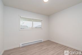 Coeur D'alene apartment for rent - A room with a window and a radiator on the floor.