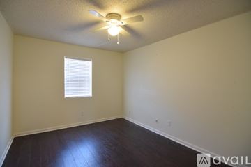 Killeen house for rent - A kitchen with white cabinets and a marble countertop.