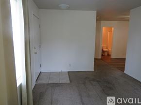 Boise townhouse for rent - A room with a carpeted floor and white walls.
