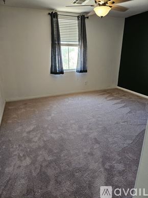 Las Vegas apartment for rent - A room with a carpeted floor and a ceiling fan.