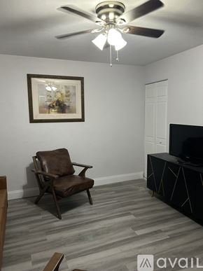 Cape Coral apartment for rent - A kitchen with a refrigerator, microwave, and dishwasher.