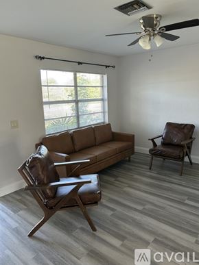 Cape Coral apartment for rent - A room with a ceiling fan and tile flooring.