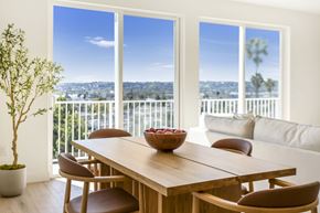 Los Angeles apartment for rent - A dining table with chairs and a bowl of fruit on it.