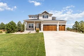 Castle Rock house for rent - A large house with a garage and a driveway.