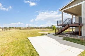 Castle Rock house for rent - A house with a patio and a concrete walkway.