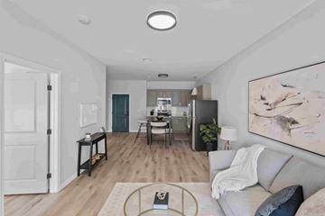 East Providence apartment for rent - A modern living room with a grey sofa and a coffee table.