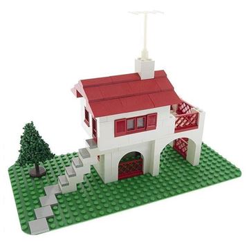 Los Angeles apartment for rent - A white and red house with a green tree and a white chimney.