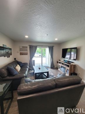 Polson apartment for rent - A living room with a couch, chair, and television.