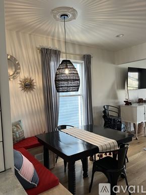 St. Joseph house for rent - A dining room with a black table and chairs.