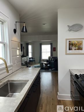 St. Joseph house for rent - A kitchen with a sink and a fridge.