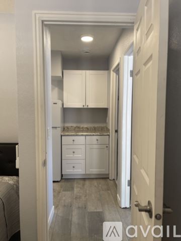 St. George apartment for rent - A small kitchen with white cabinets and a countertop.