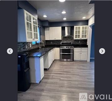 Antioch house for rent - A modern kitchen with a black countertop and stainless steel appliances.