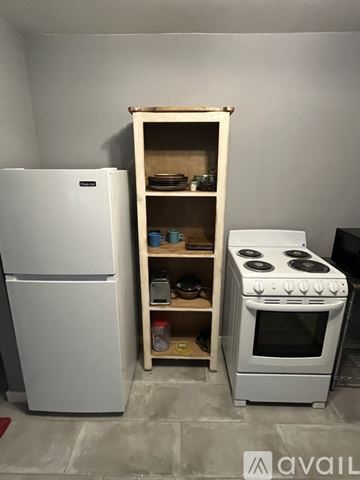 Wickenburg apartment for rent - A white refrigerator and stove are in a kitchen.