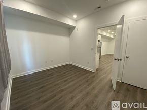 Philadelphia apartment for rent - A room with wooden flooring and white walls.