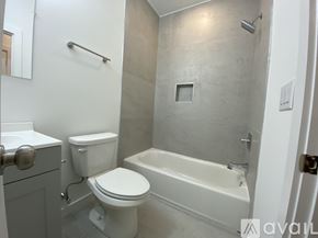 Philadelphia apartment for rent - A white toilet and sink in a bathroom.
