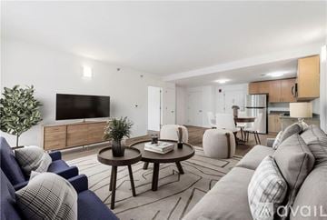Peekskill apartment for rent - A living room with a grey couch and a wooden coffee table.