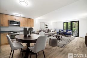 Peekskill apartment for rent - A modern kitchen with a dining table and chairs.