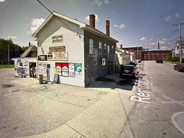 West Warwick apartment for rent - A white building with a sign that says Bread Stuffs.