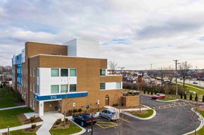 Arlington Heights apartment for rent - A modern building with the number 310 on it.