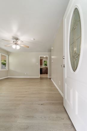 Jacksonville house for rent - A white door with a glass window is on the right side of the room.