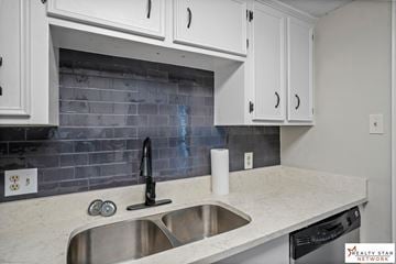 Hattiesburg house for rent - A kitchen with a sink and a dishwasher.
