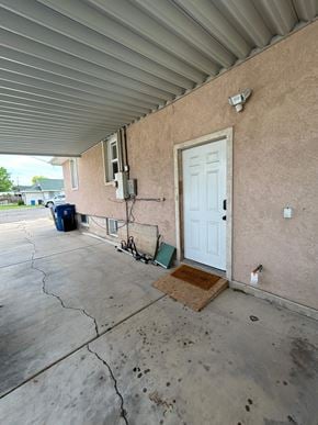 Payson house for rent - A white door is on the side of a building.