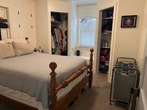 Payson house for rent - A bedroom with a bed, a suitcase, and a closet.