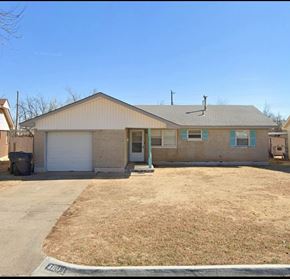 Oklahoma City house for rent - A house with a garage and a driveway.