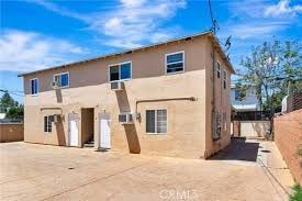 North Hollywood apartment for rent - A two-story house with a flat roof and a garage door.