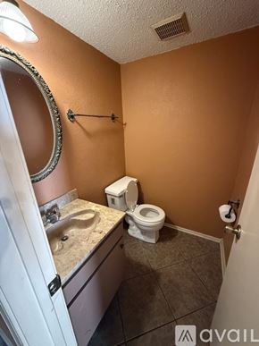 Harvey townhouse for rent - A room with a brown carpet and a white wall.