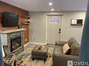 Colorado Springs apartment for rent - A living room with a fireplace and a couch.