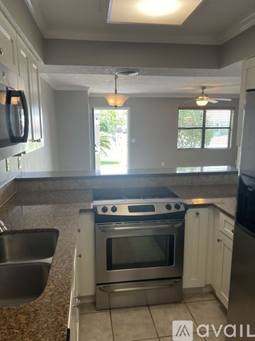 St. Augustine Beach apartment for rent - A kitchen with a stove top oven and a dishwasher.