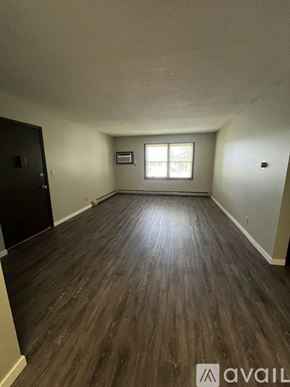 North Mankato apartment for rent - A room with wooden flooring and a window.