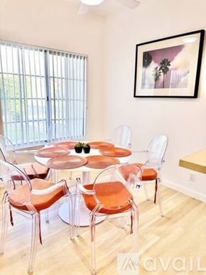 Palm Desert house for rent - A dining room with a round table and chairs.