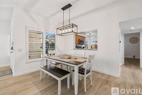 Palm Desert house for rent - A dining area with a table and chairs is shown in the image.